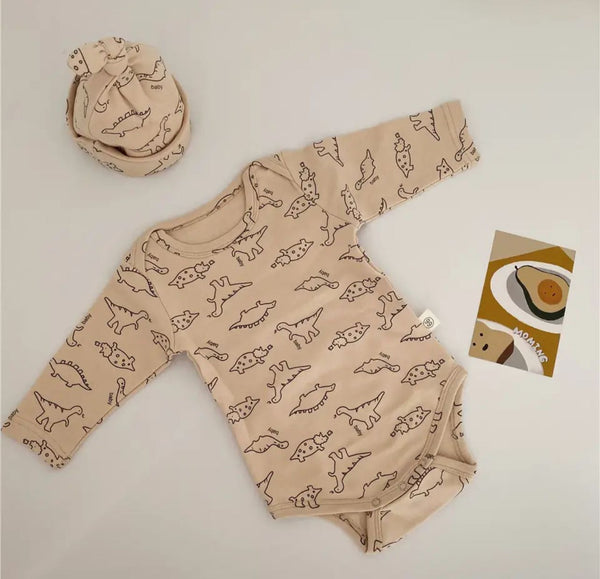ENTERIZO BODY DINOSAURIOS CREMA